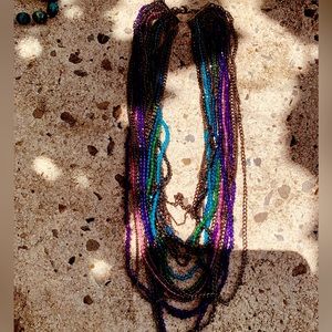 Dazzling crystals strands in purple and blue hues drapes any neckline